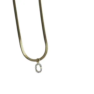 Gold flat snake chain necklace featuring a sparkling cubic zirconia letter O pendant.