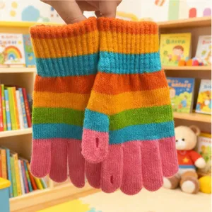 Detail view of winter warm knit rainbow striped gloves with touch screen fingers for adults.