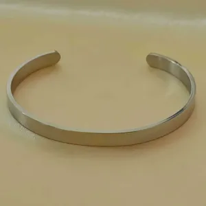 Stainless steel smooth open cuff bracelet, minimalist metallic silver detail view.