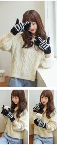 Winter warm plush touchscreen gloves for women, cute black and white striped cozy knit mittens.