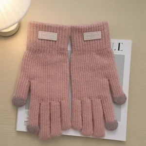 Cozy pink winter knit touchscreen gloves with patch, warm fleece-lined cold weather gloves.