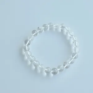 Clear quartz crystal beaded stretch bracelet detail, natural gemstone handmade jewelry view.
