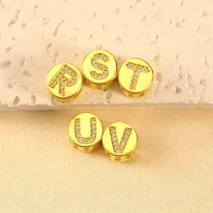 Gold-plated round alphabet spacer beads with pavé rhinestones for DIY jewelry making details.