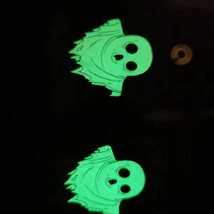 Close-up detail of the glowing ghost pattern in the dark, highlighting the luminous night effect.