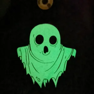 Halloween glow in the dark ghost pattern glove detail view, cozy winter thermal wear.