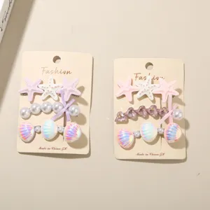 Detail von 3-teiliges Meeres-Haarspangen-Set mit Seesternen, Perlen und Muscheln.