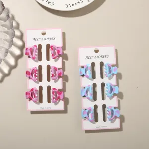 Close-up of mini 2.5cm colorful leopard print hair claw clips on display cards