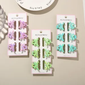 Close-up of 6-piece mini bow hair claw clip sets in macaron iridescent colors.