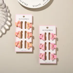 Close-up of 6-piece set of 2.5cm mini colorful marbled hair claw clips on white cards