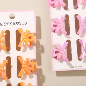 Detail view of 6-piece set of 3cm mini bow hair clips in vibrant macaron gradient