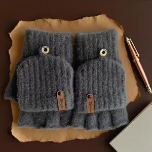 Grey knit convertible fingerless gloves detail shot showing soft texture and cute button design.