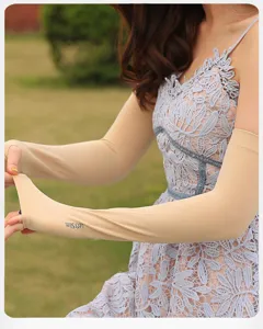Detail view of summer outdoor sun protection sleeves in beige, skin-friendly cooling fabric.
