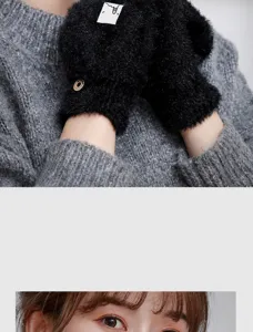 Close-up detail of black plush knit half-finger convertible gloves showing soft texture.