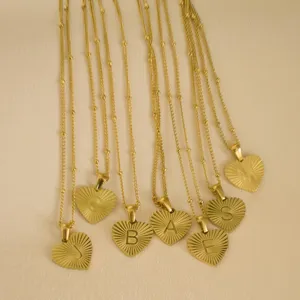 Minimalist gold stainless steel sun ray heart letter pendant necklace, main product view.