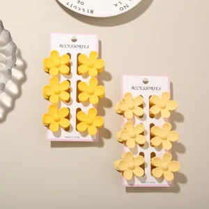 Detailed close-up showing two 6-piece sets of vibrant 3.5cm dopamine flower hair claw clips