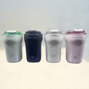 Detailed view of insulated coffee cups in four colors with Future is Now slogan