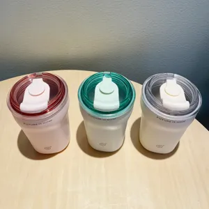 Set of three minimalist insulated stainless steel coffee tumblers in soft colors