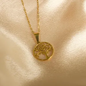 Gold stainless steel tree pendant necklace detail view, elegant fashion jewelry accessory.