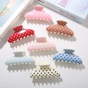 Lot de pinces à cheveux à pois de 10,5 cm aux motifs pastels et couleurs vives.