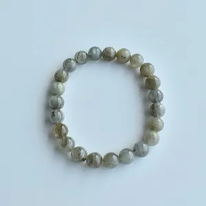 Labradorite gemstone bead bracelet detail view, smooth polished surface with shimmer.