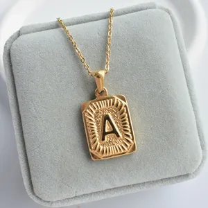 Gold stainless steel initial letter A pendant necklace with sunburst rectangular geometric charm.