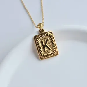 Gold stainless steel square letter K pendant necklace detail shot close up fashion jewelry accessory