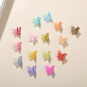 Detailed view of 14 colorful butterfly mini hair clips made of clear plastic