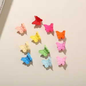 A detailed view showing colorful 2cm butterfly mini hair clips in matte plastic finish