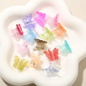 Detailed macro view showing a variety of colorful 2cm translucent butterfly mini hair claw clips