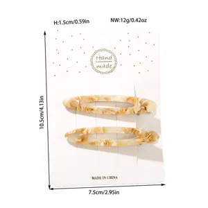 Detail view of marble acetate hair clips with exact dimensions and weight specs