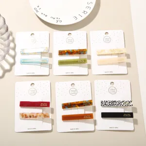 Detailed view of handmade acetate duckbill hair clip sets in multiple colors
