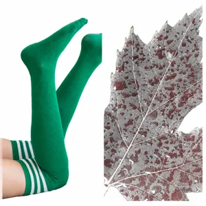Green over the knee long socks with white stripes, stylish leg wear and leaf pattern design.