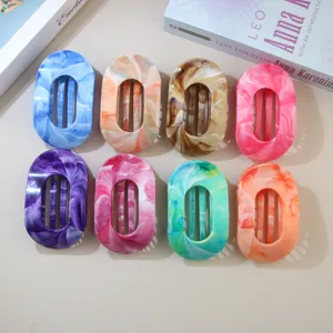 Detailed view of 8 colorful marble-patterned ABS oval duckbill hair clips for hair styling