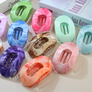 Collection of colorful marbled ABS oval hair claw clips for elegant women's hairstyles