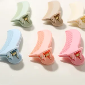 Detailed view of multi-functional comb hair clips in various pastel macaron colors
