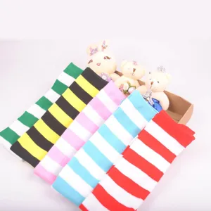 Close-up detail of colorful wide-striped over-the-knee socks, soft cotton blend material.