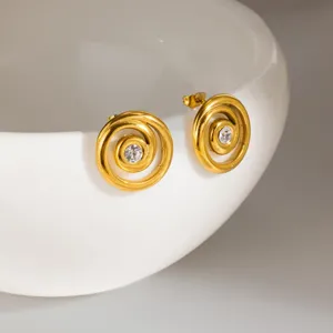 Gold stainless steel spiral stud earrings featuring a sparkling central stone detail.
