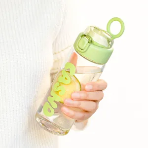 Minimalist transparent glass water bottle with green bounce lid and carrying loop