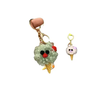 Cute plush ice cream cone keychain and bag charm featuring a funny cartoon face