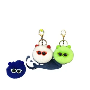 Set of three cute fuzzy plush pom-pom keychains with sunglasses for bags and keys