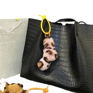 Fashionable leopard print plush keychain charm with creative yellow silicone twist knot