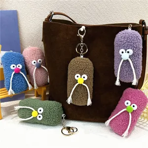 Detailed view of colorful plush mustache keychains used as funny bag charms and gifts
