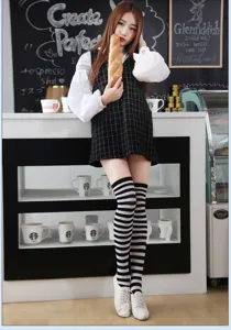 Fashion black and white striped over the knee socks for women and teen girls casual style.