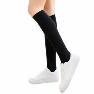 Solid color knee high socks for women, casual school uniform hosiery, daily spring wear.