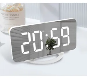 Modern curved LED digital mirror alarm clock detail view showing clear white display and stand.
