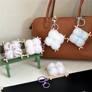 Detailed view of cute plush charms shaped like stinky tofu on a miniature bench