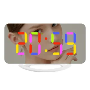 Modern LED digital mirror alarm clock with colorful RGB display and stable desktop stand.