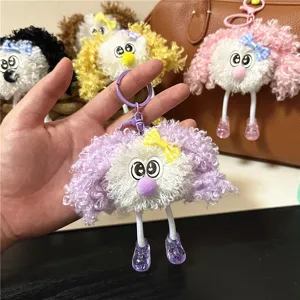 Detail view of cute curly hair plush doll keychains in vibrant colors for bag charms