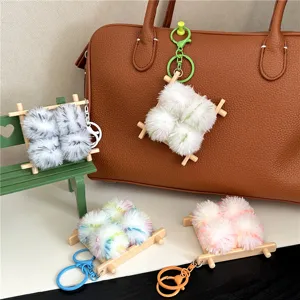 Group of creative food-shaped plush charms in various colors on a handbag.