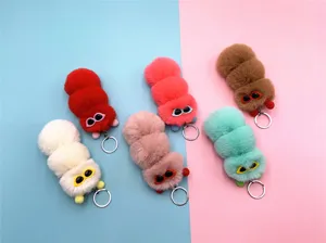 Detail of colorful plush caterpillar keychains in soft candy-colored faux fur